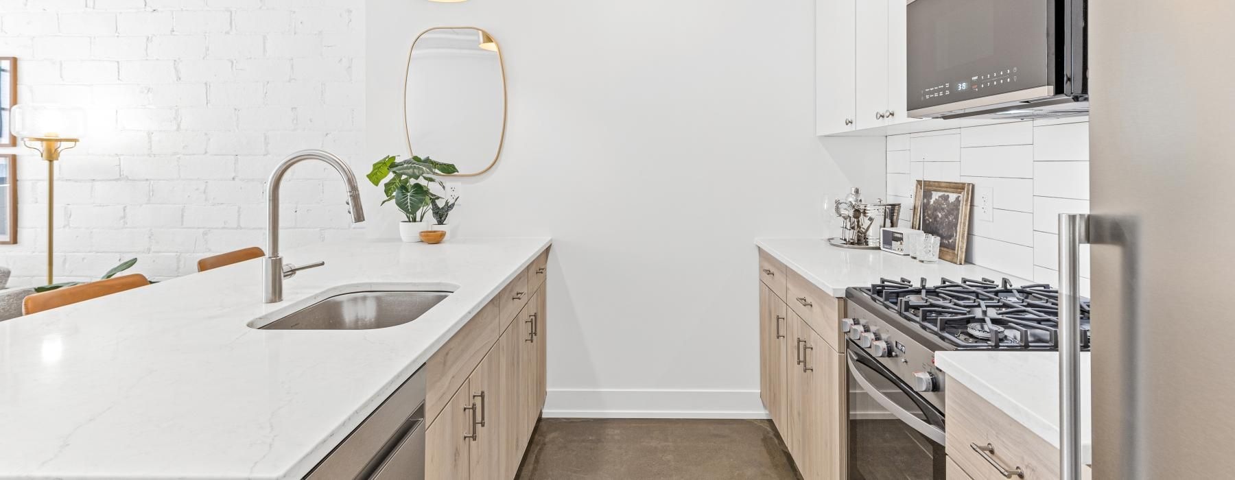 a kitchen with white cabinets