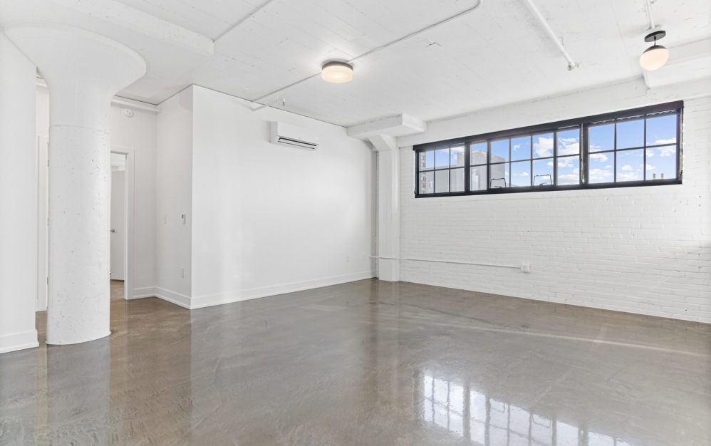 Living room with brick wall