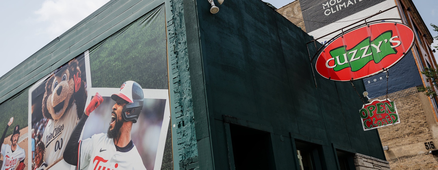 Cuzzy's Bar with Mural of Baseball Player