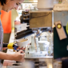 a barista making coffee