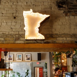 a neon sign on a wall