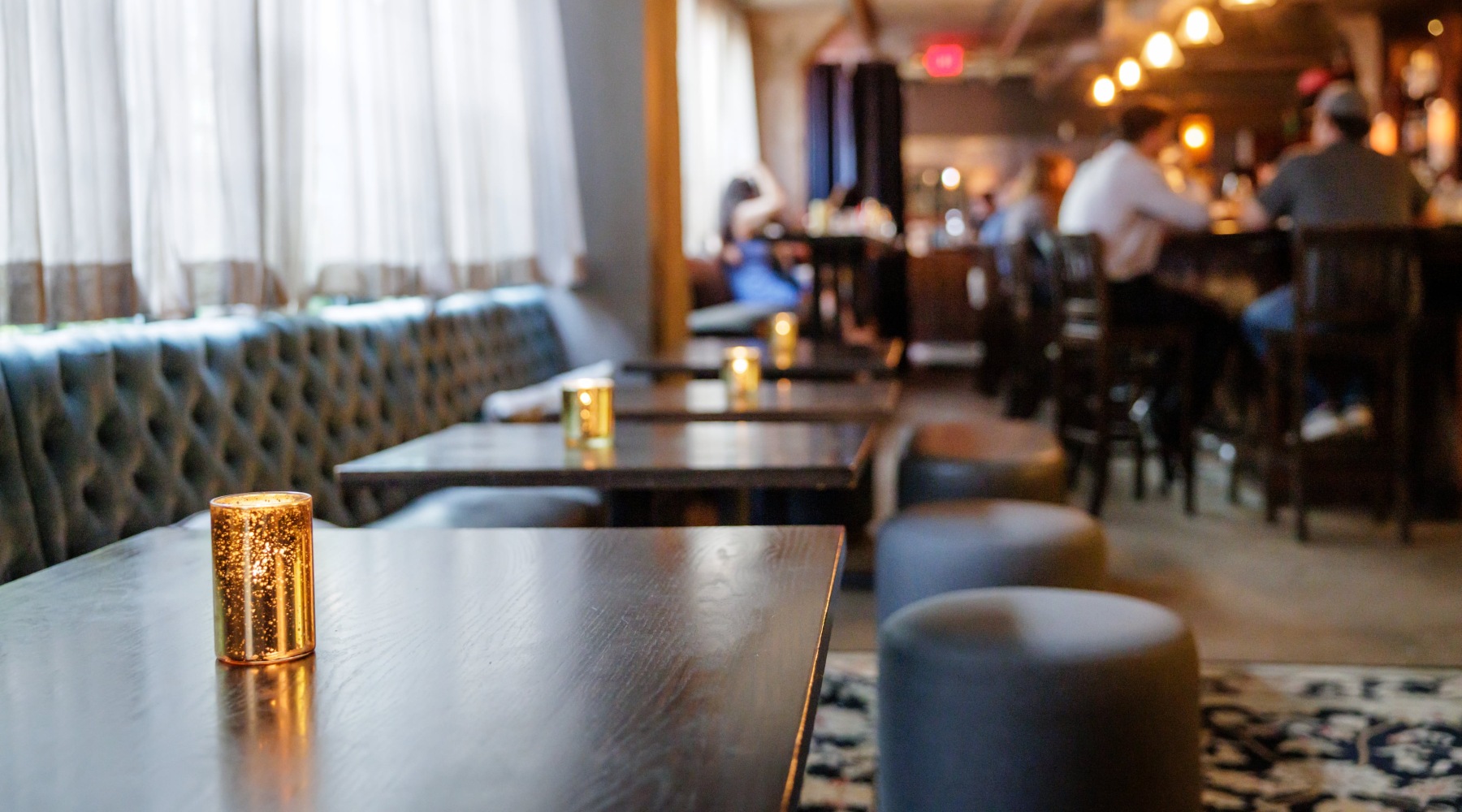a dining area with a close-up of a drink