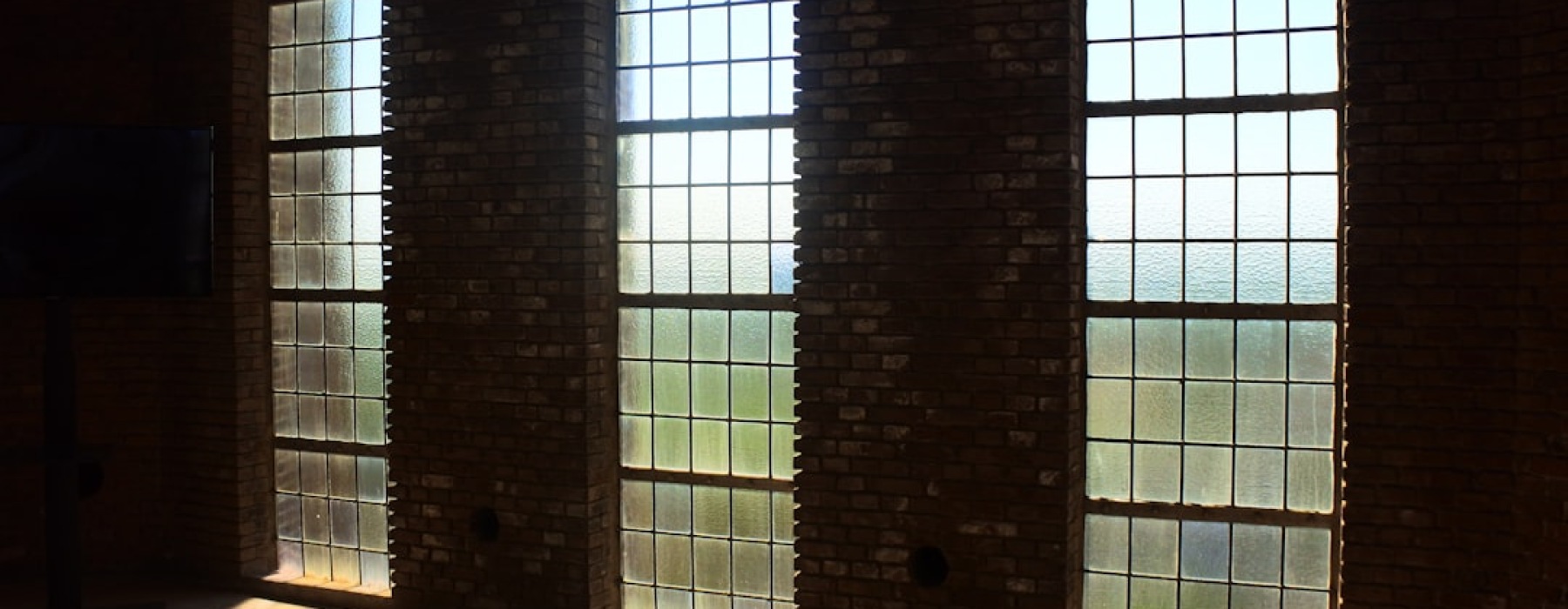 Loft apartments Minneapolis interior with exposed brick and large windows - loft apartments Minneapolis